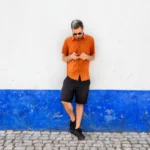full-length-young-man-standing-against-wall